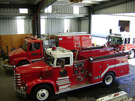 Large repair shop with fire trucks